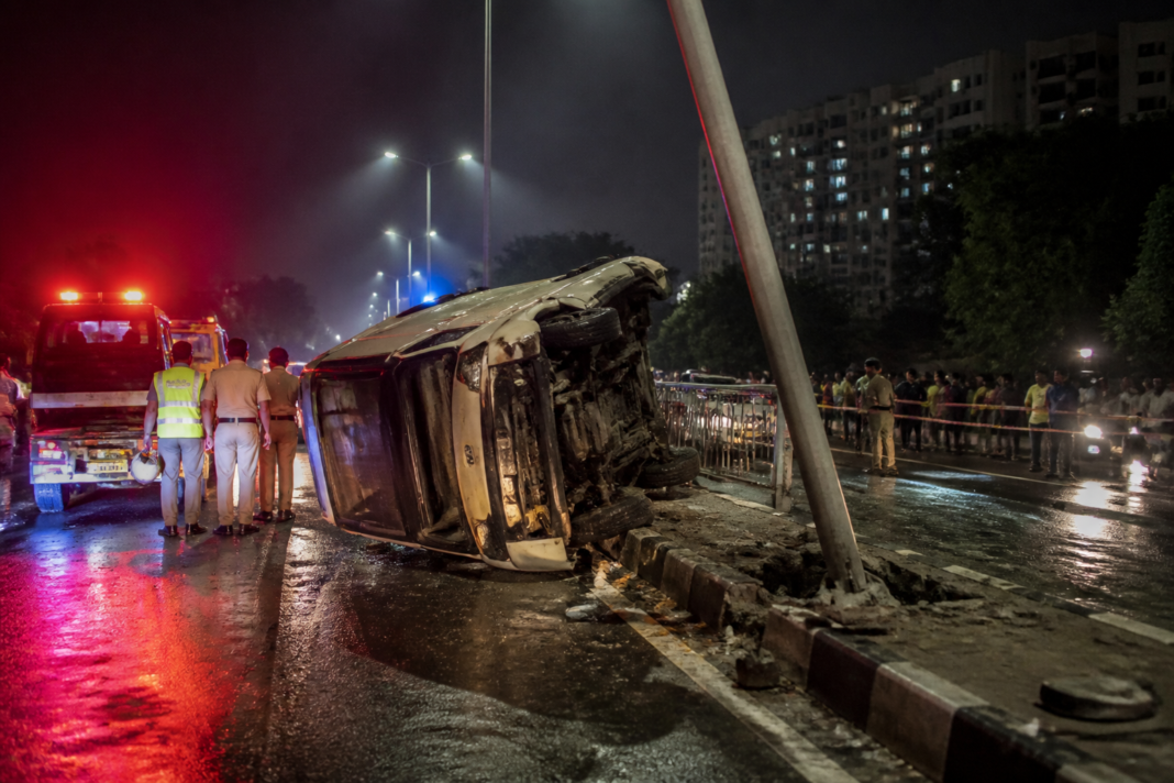 Bengaluru wheeling accident site near Nagarabhavi with a crashed tempo traveller and damaged electricity pole