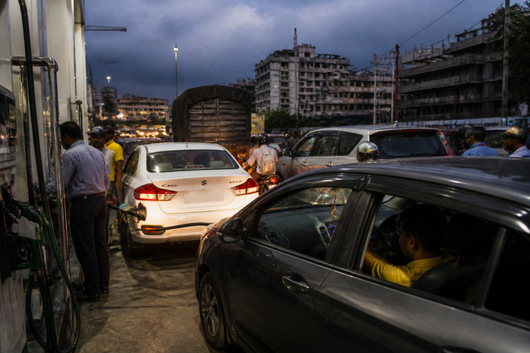 India petrol prices under pressure at a busy urban fuel station