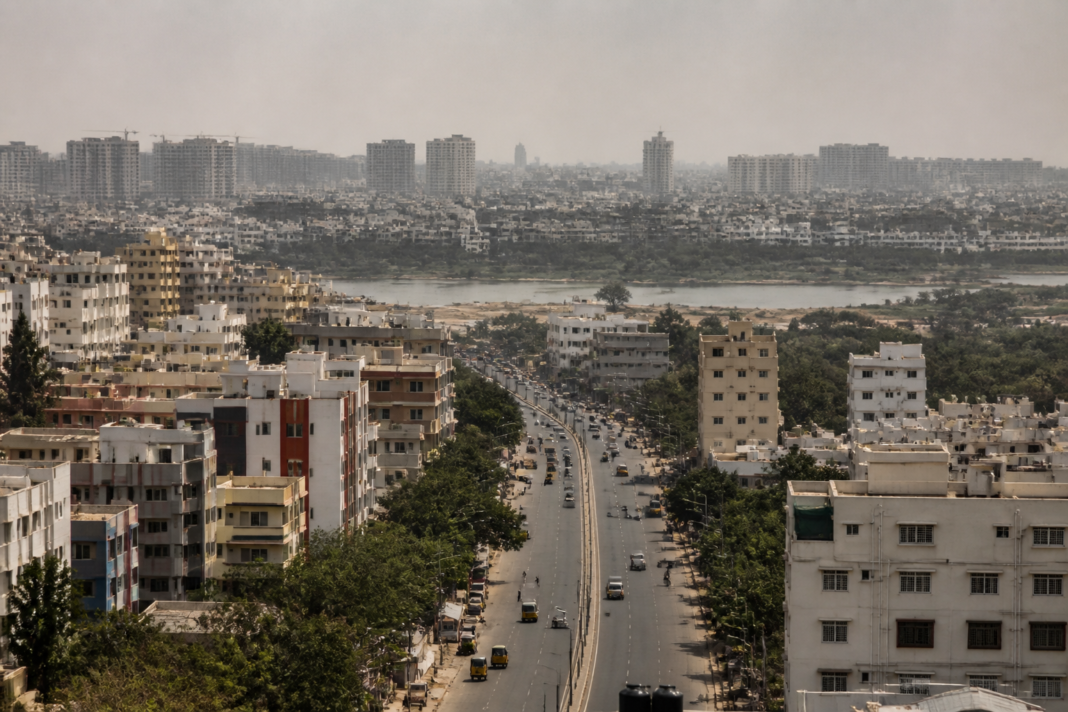 Telangana heat humidity over Hyderabad’s concrete skyline during a hazy summer afternoon