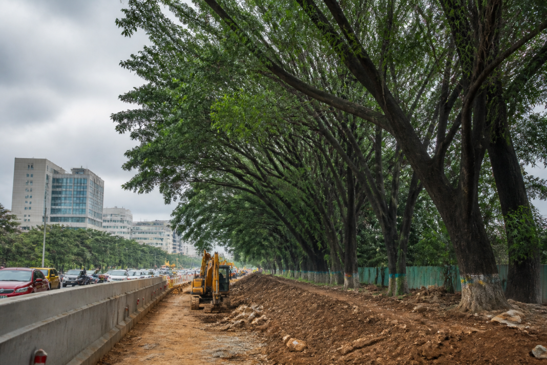 Bengaluru tunnel project work near Hebbal road with trees and construction activity