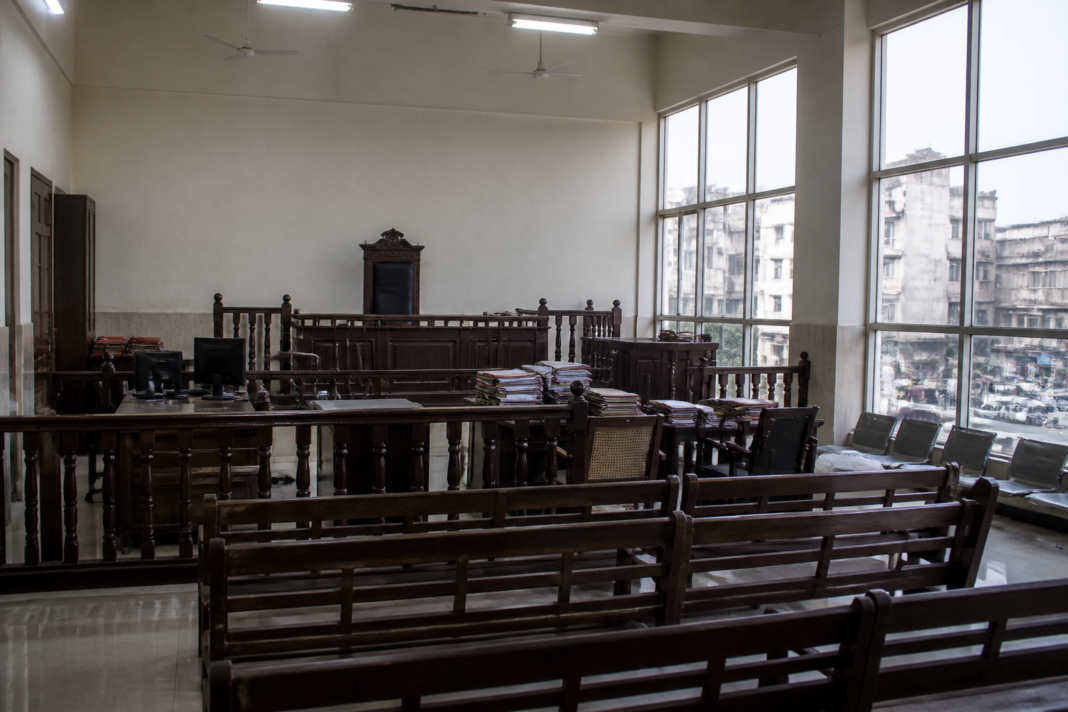Maharashtra judicial vacancies reflected in an empty courtroom and Bombay High Court exterior