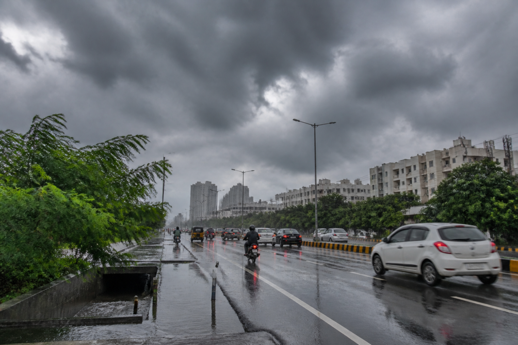 Telangana rain alert showing heavy rain over Hyderabad streets and urban infrastructure