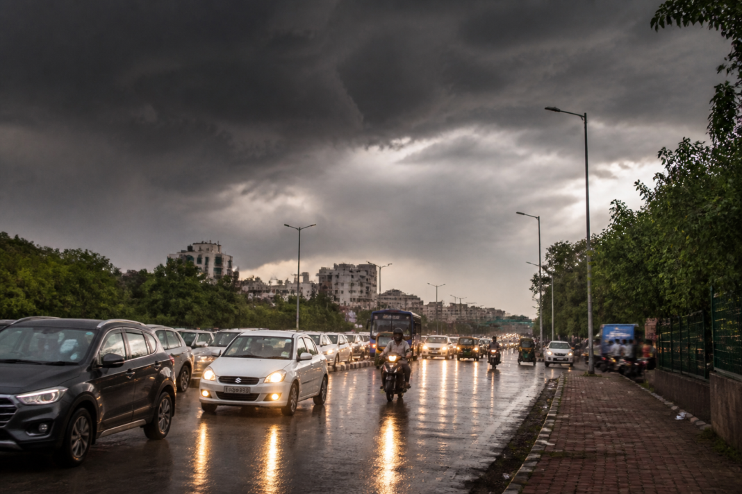 Delhi-NCR weather under dark clouds with light rain and traffic on an urban road