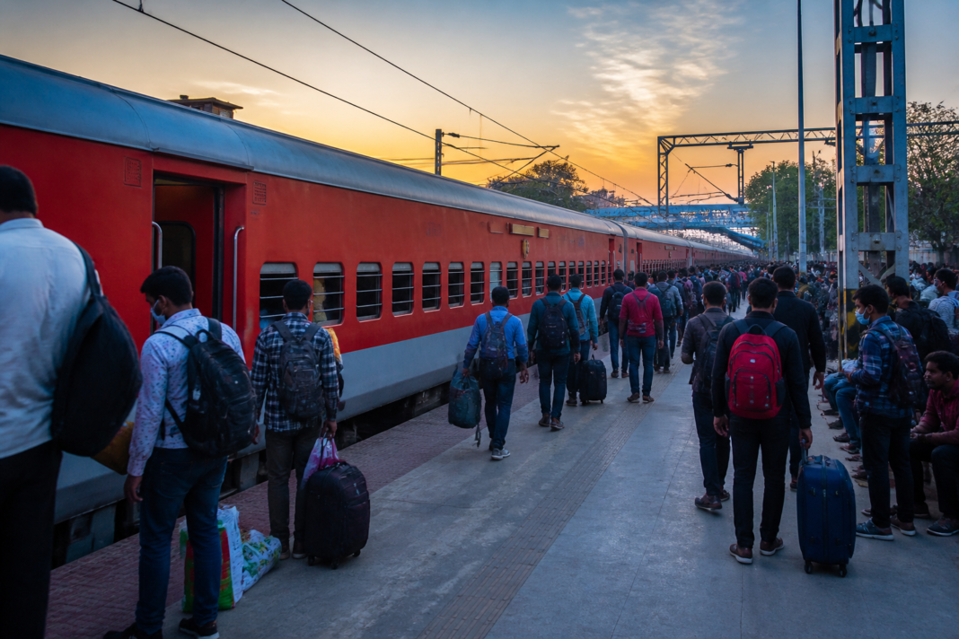 Hazrat Nizamuddin Prayagraj special train at a busy Indian railway station
