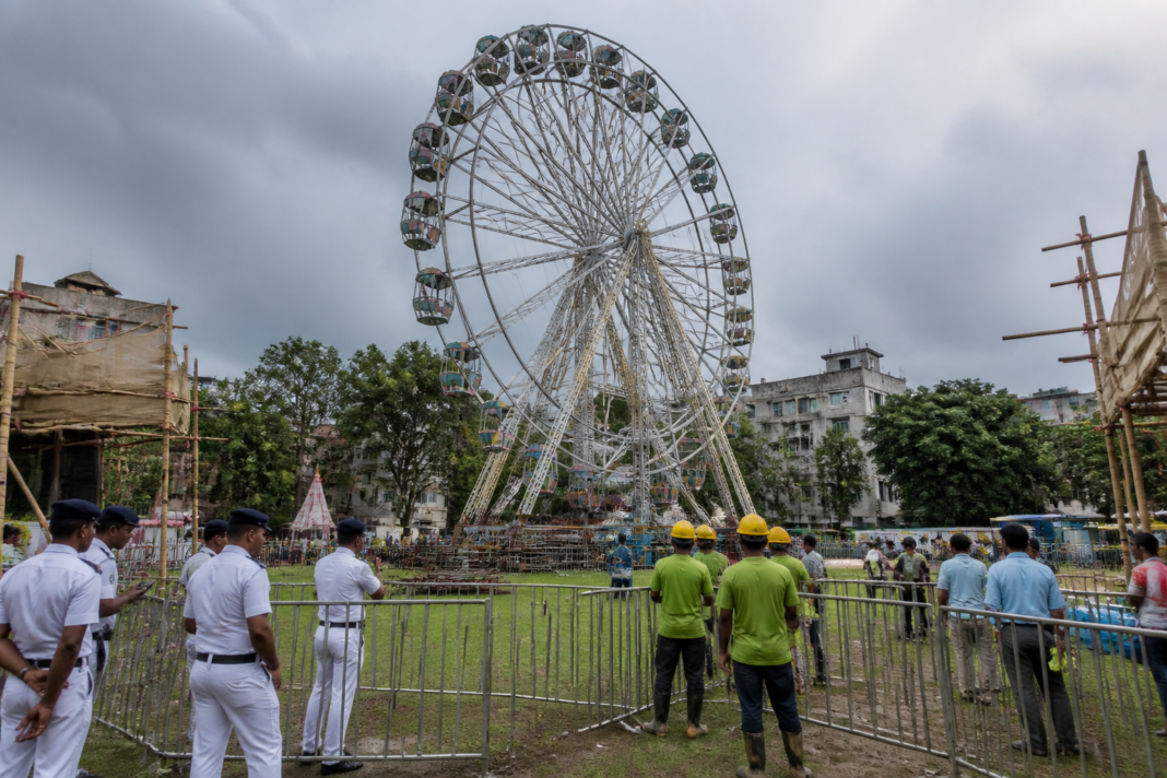 Kolkata Ferris wheel at a fenced-off public festival ground