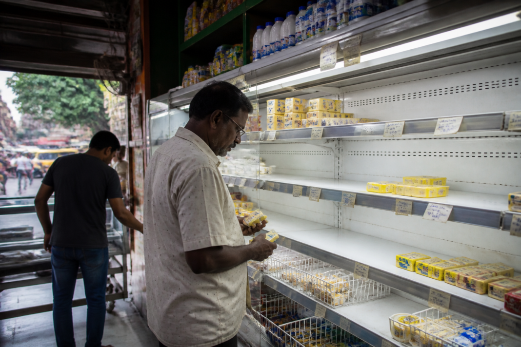 Kolkata butter shortage leaves butter shelves partly empty at a grocery store ahead of Durga Puja.