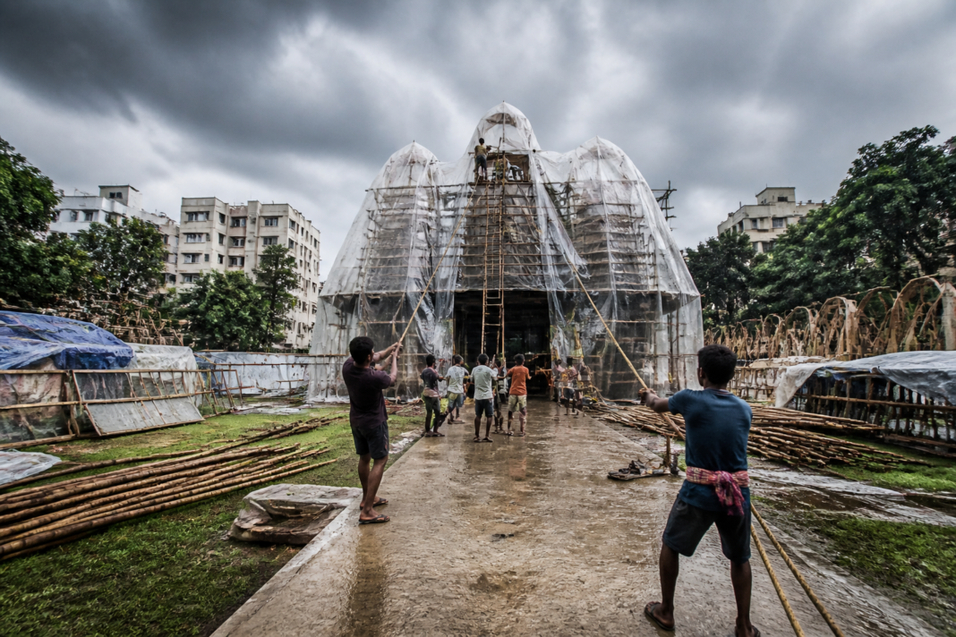 Kolkata Durga Puja pandal covered with protective sheets ahead of rain