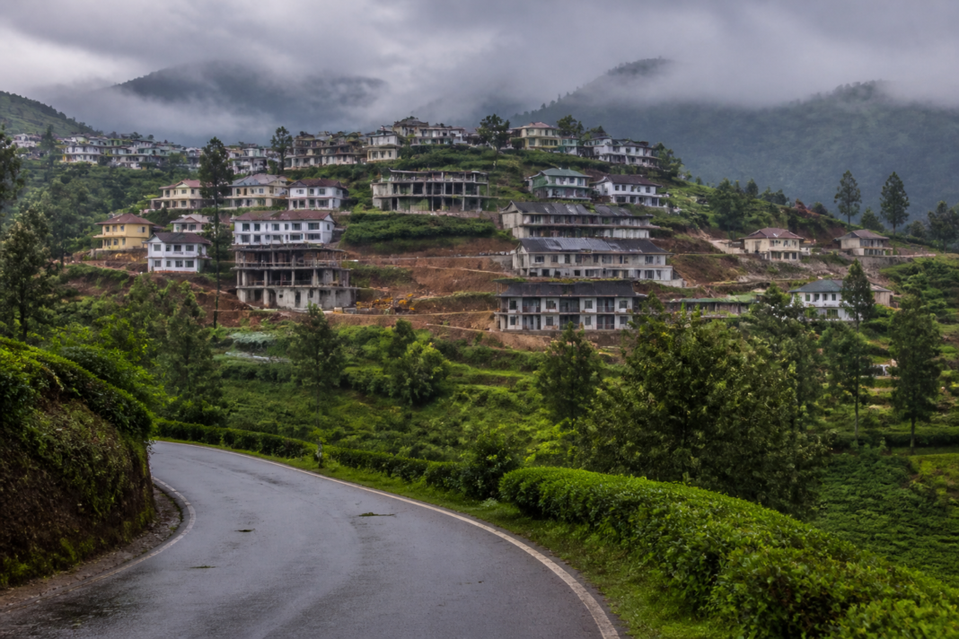 Nilgiris homestay violations amid expanding hillside buildings and green landscapes