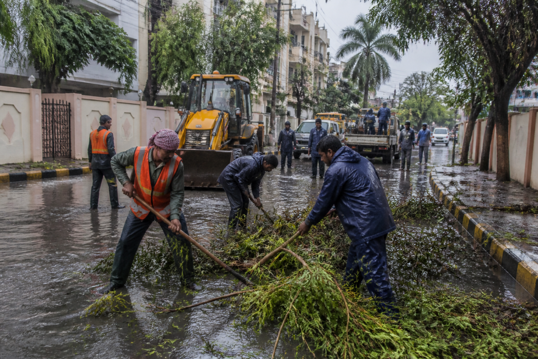 GVMC rain relief operations on a waterlogged Visakhapatnam road