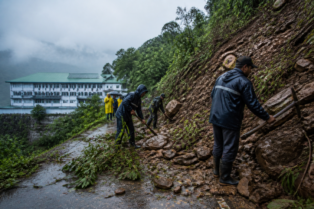 Darjeeling landslides blocking a rain-soaked hill road near a rural hospital