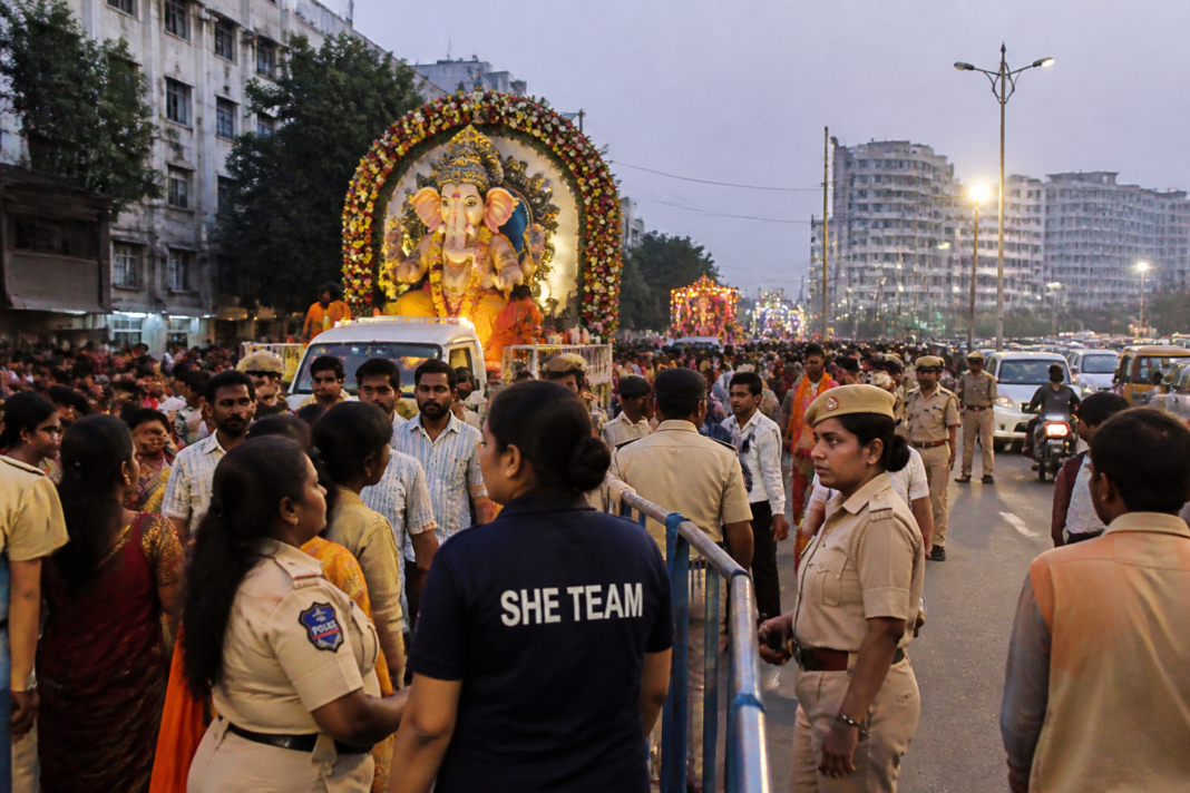 Hyderabad Ganesh festivities with police managing a crowded immersion procession