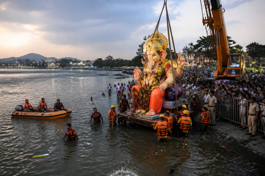 Telangana Ganesh immersions managed with cranes, barricades and emergency teams at a riverbank