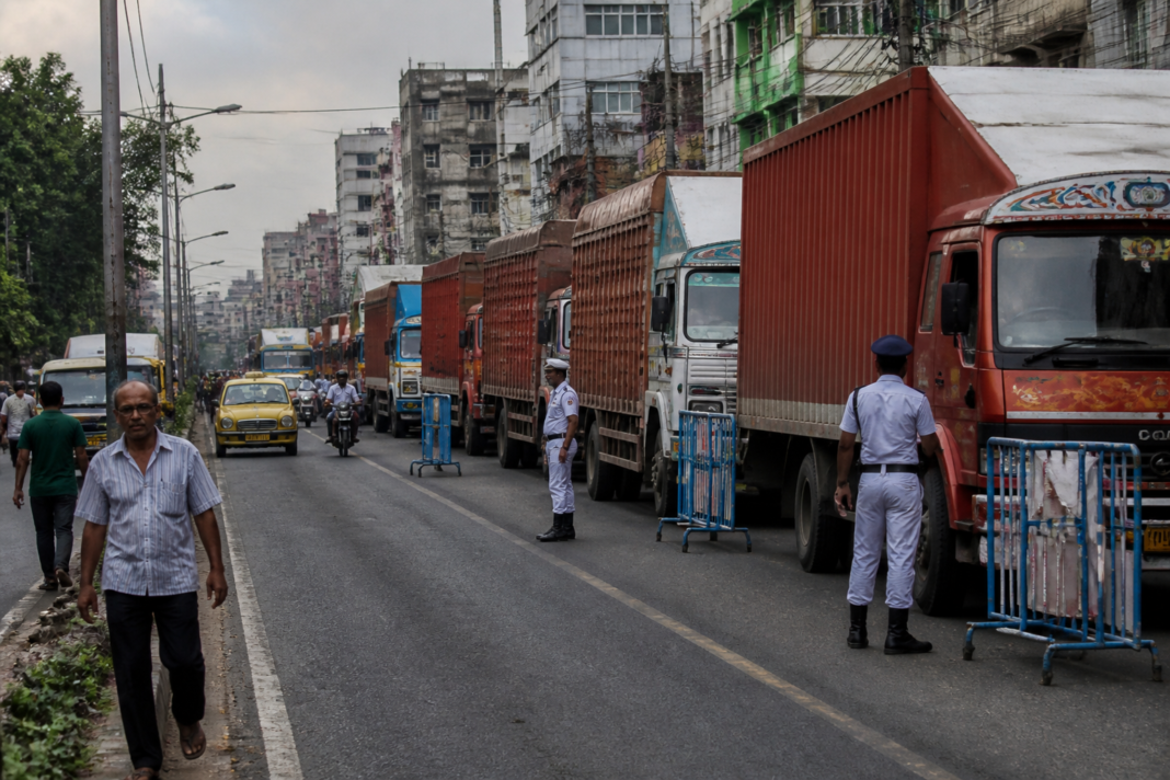 Kolkata truck no-entry restrictions on a congested urban road with commercial vehicles