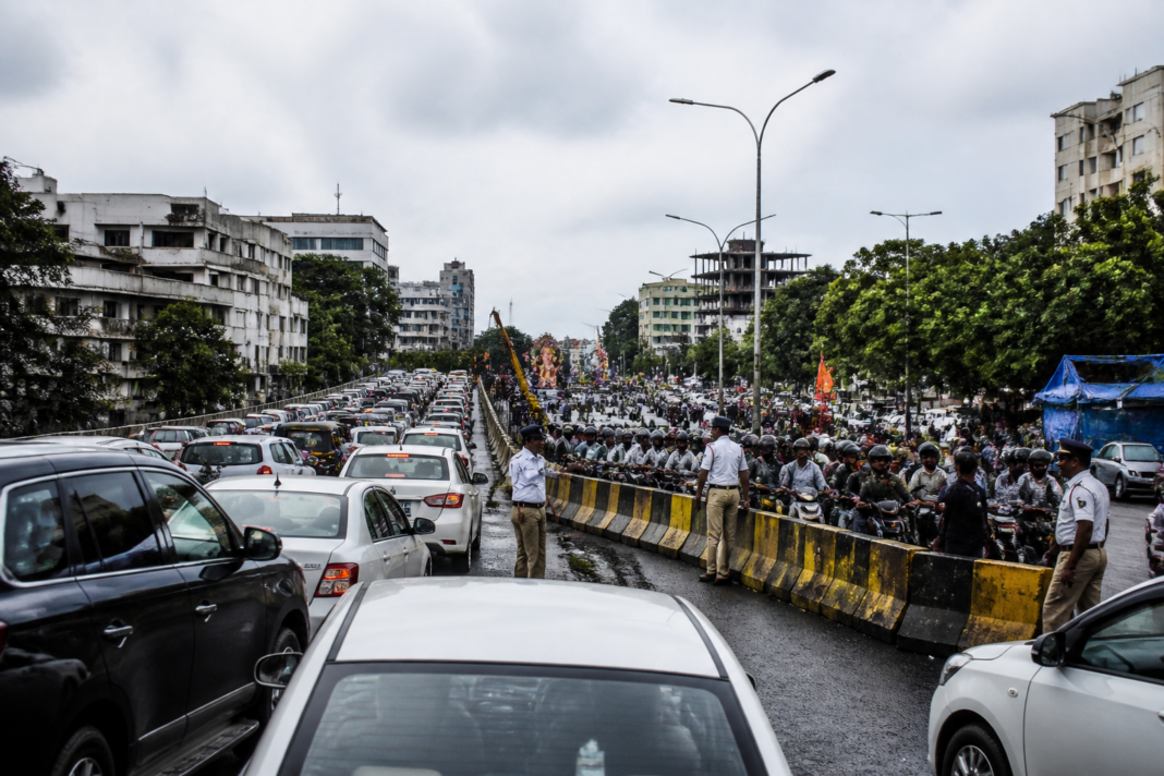 Hyderabad traffic restrictions near Hussain Sagar causing vehicle queues during Ganesh immersion diversions.