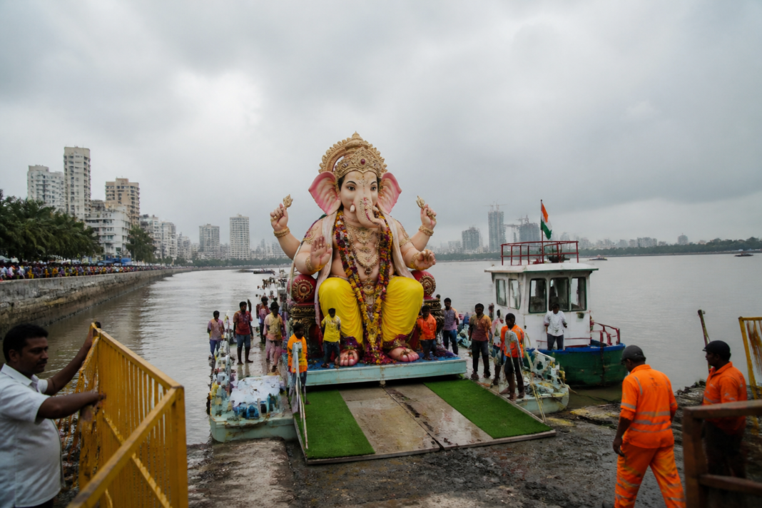 Mira Bhayandar Ganpati visarjan with large idols being transported for immersion