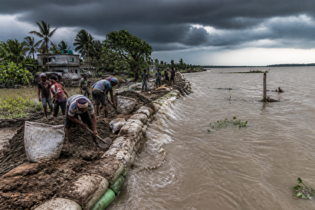 Gangasagar floodwater entering a village after a river embankment breach