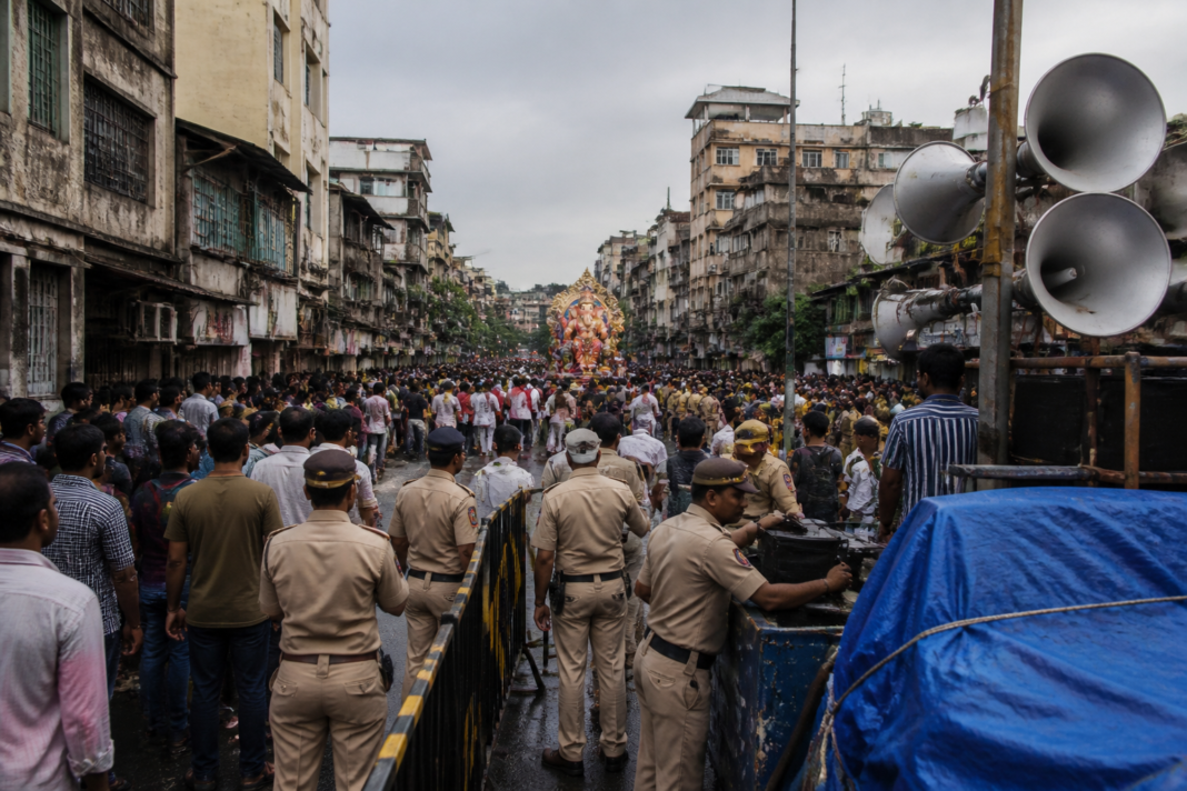 Pune noise pollution campaign near a crowded Ganesh immersion procession