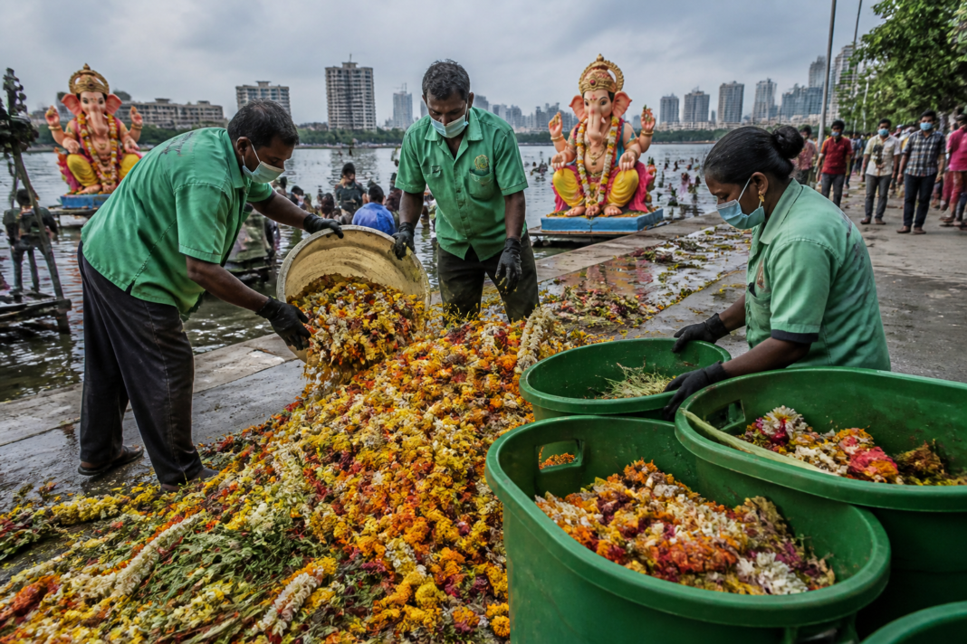 Ganesh immersion waste and collected flowers at a Cyberabad immersion point