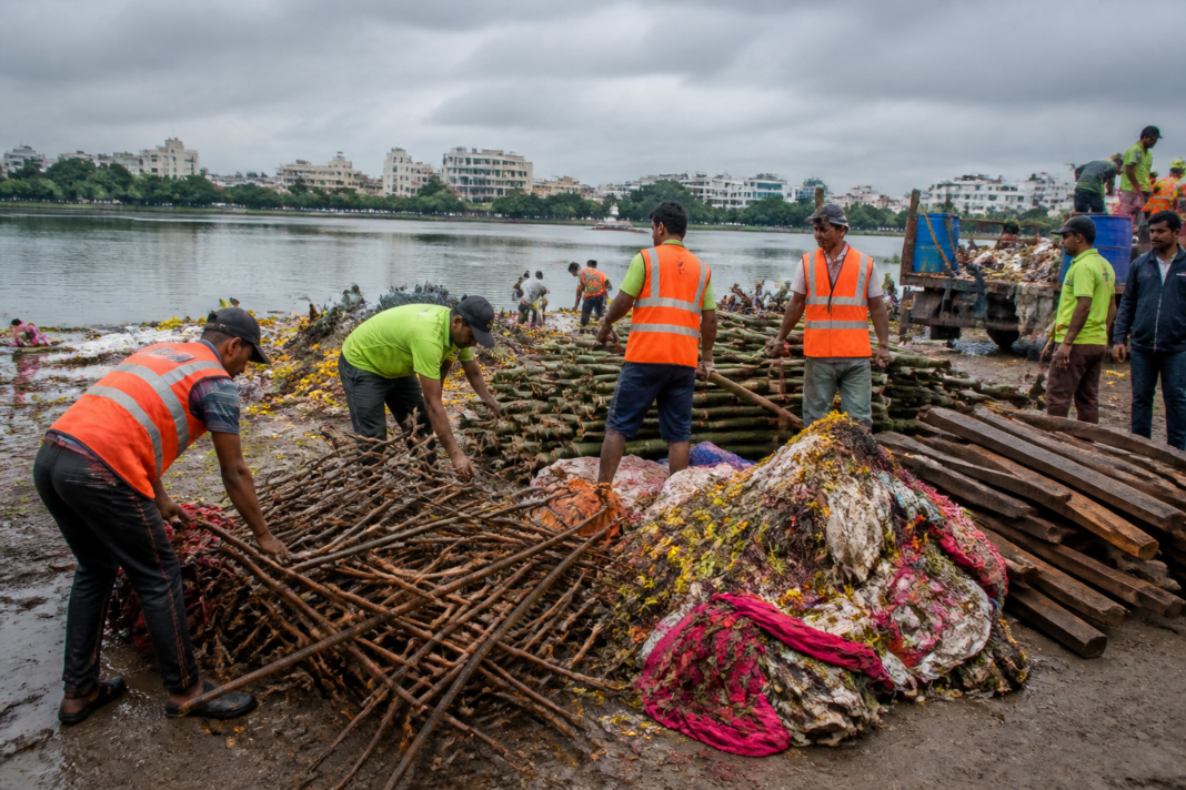 Hyderabad Ganesh immersion waste being cleared from a Hussain Sagar immersion site
