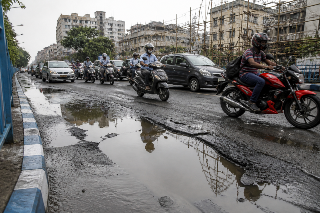 Kolkata road repairs on a rain-damaged route ahead of Durga Puja traffic