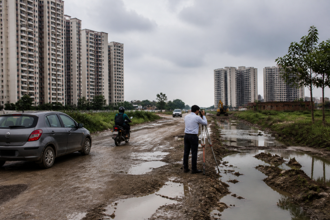 Gurugram Sector 104 road route near residential societies and village access road