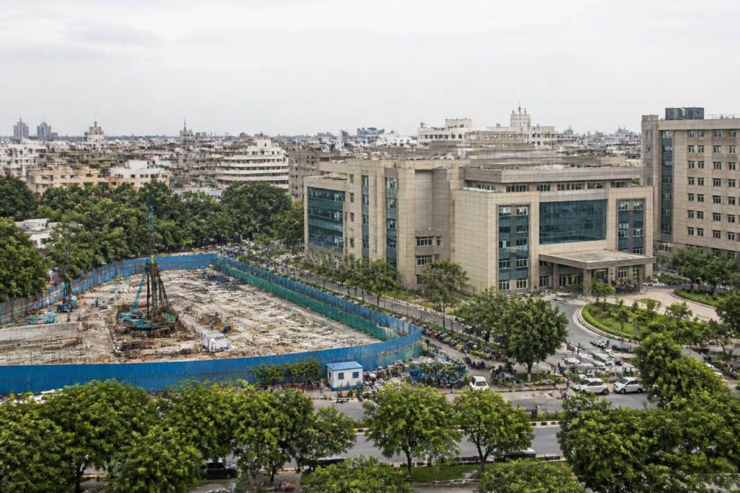 AIIMS critical care block project site with hospital infrastructure and planned parking facilities in Delhi
