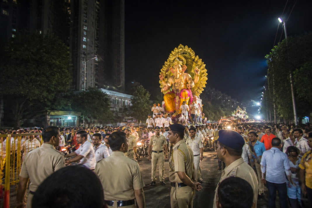 Pune laser light ban enforcement during a crowded Ganesh immersion procession