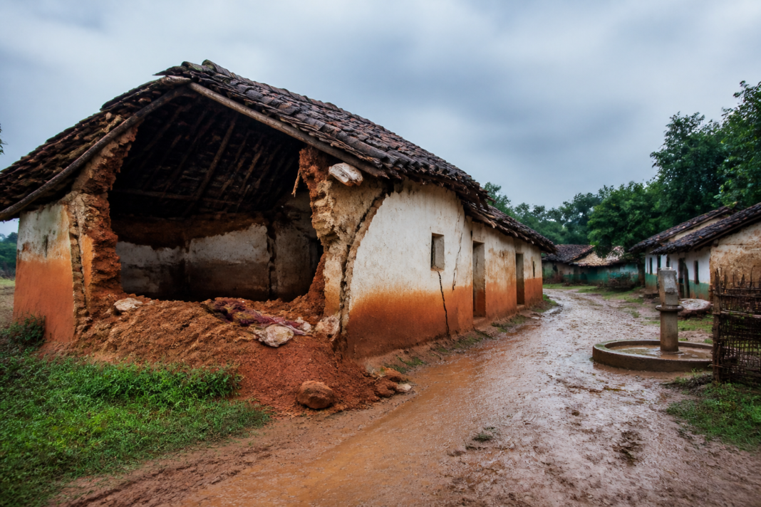 Parwati Topno home in Gumla with rain-damaged walls and a collapsed clay structure