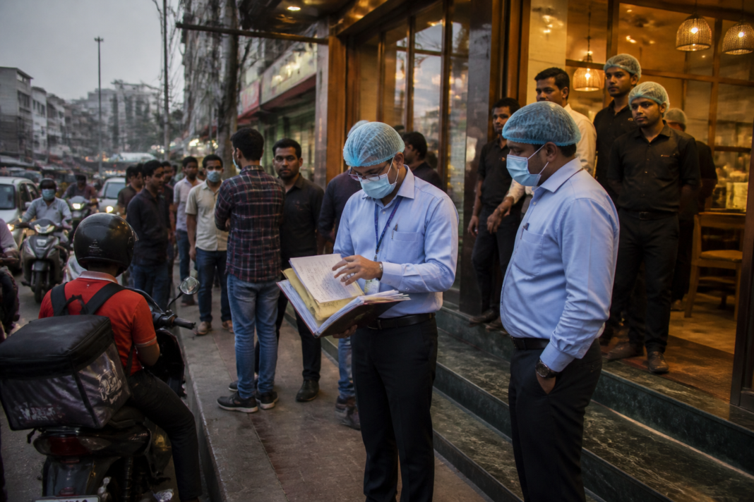 Hyderabad restaurant enforcement officials inspecting a restaurant entrance