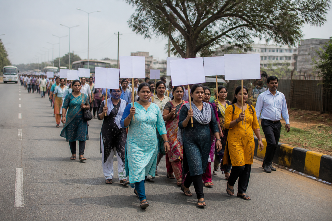 NHM contract workers marching in Karnataka over service regularisation and revised job rules