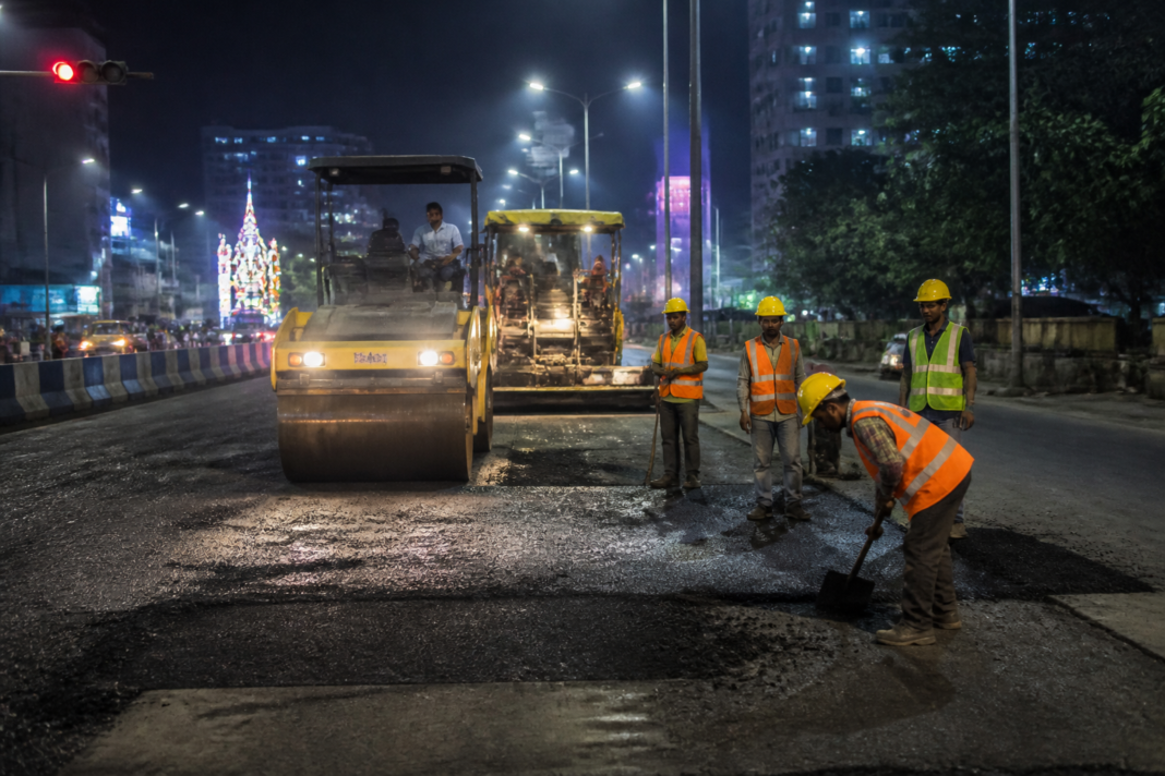 Kolkata road repairs underway on a damaged city road ahead of Durga Puja
