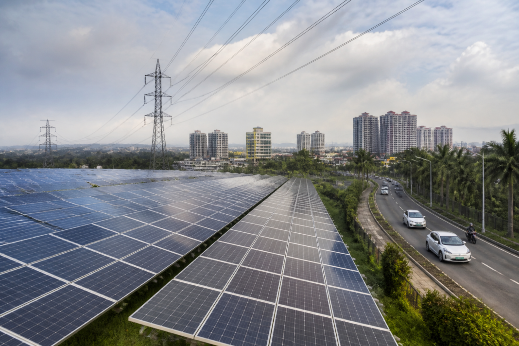 Kerala renewable energy infrastructure with solar panels and a transmission grid