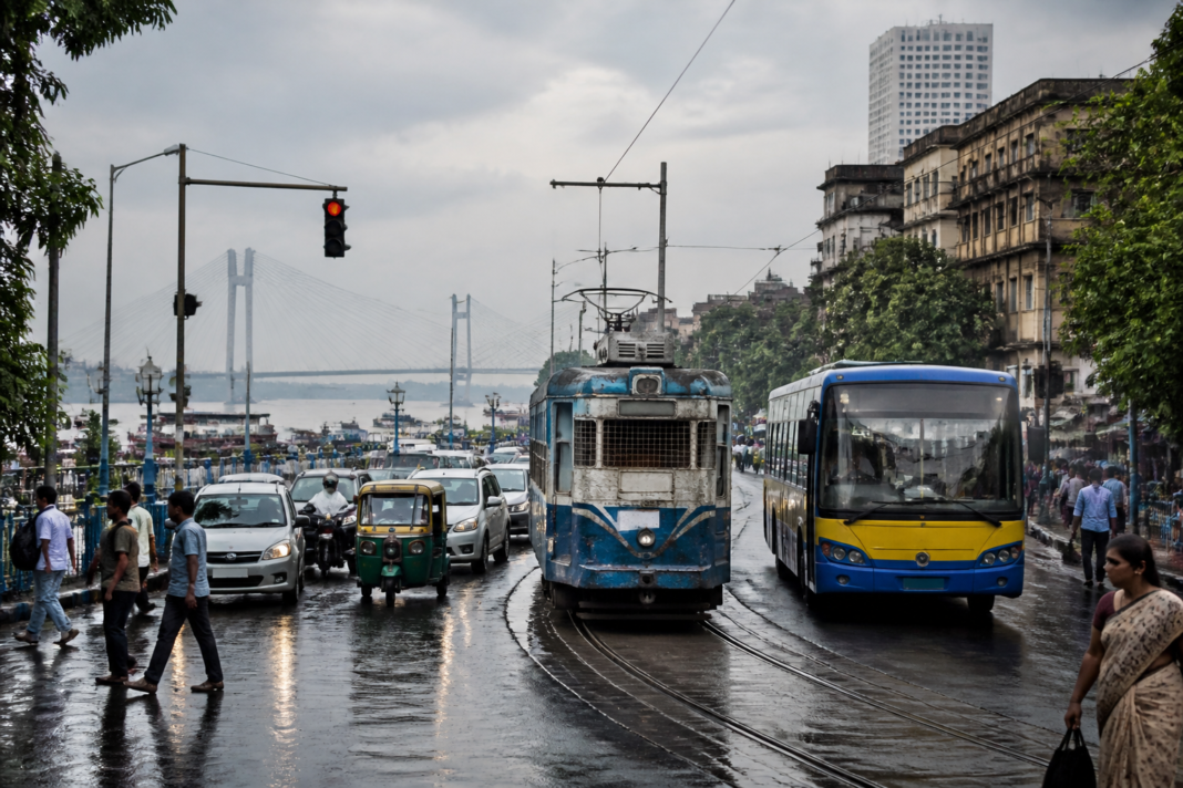 Kolkata transport roadmap with a tram, city bus and Hooghly River traffic