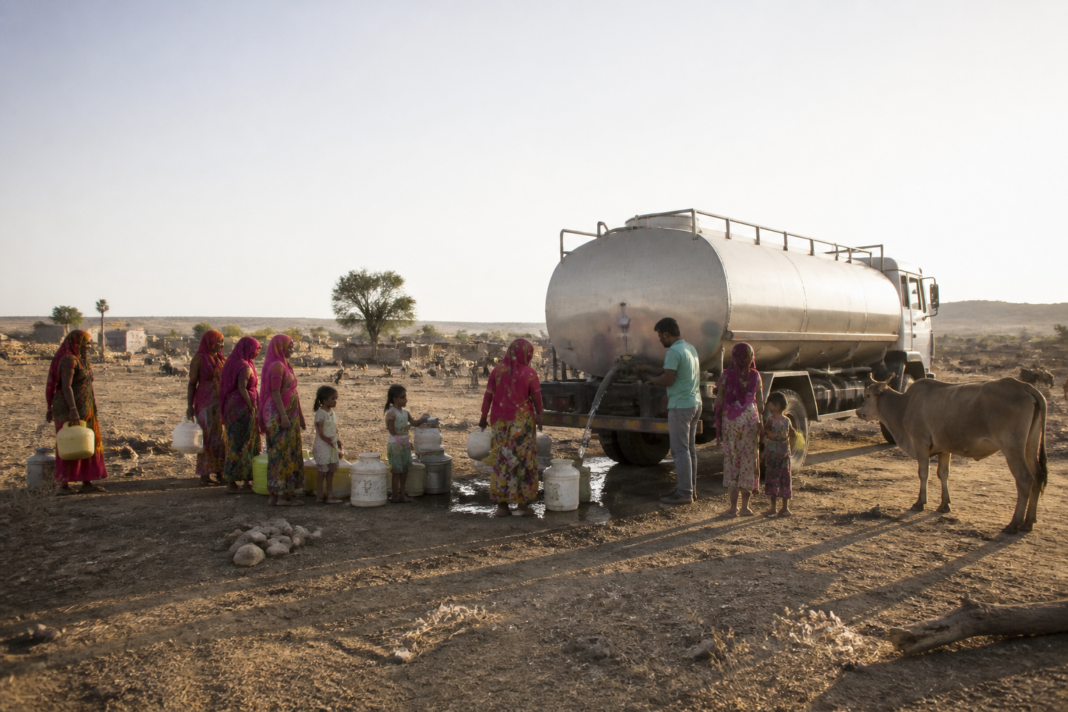 Jaisalmer Barmer drought relief tanker supplying drinking water in a dry Rajasthan settlement