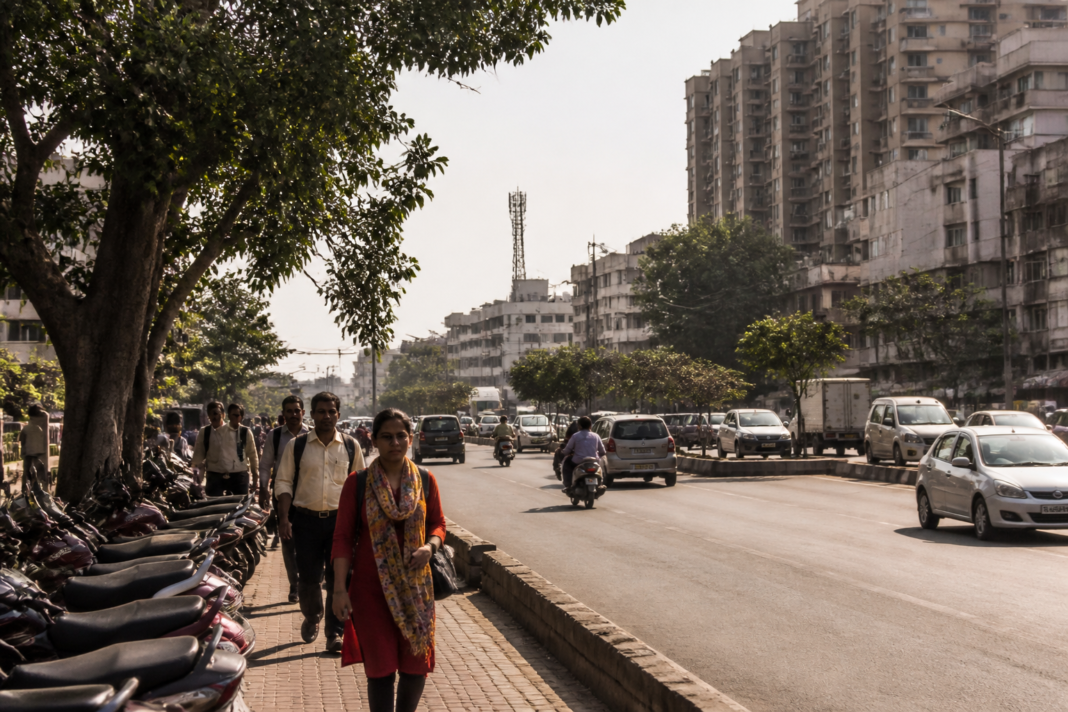 Pune weather during an early October heat spell with hazy skies and busy urban streets.