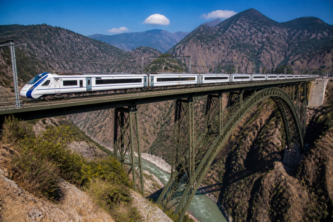 Vande Bharat train crossing the Chenab Rail Bridge on the Katra-Banihal rail link