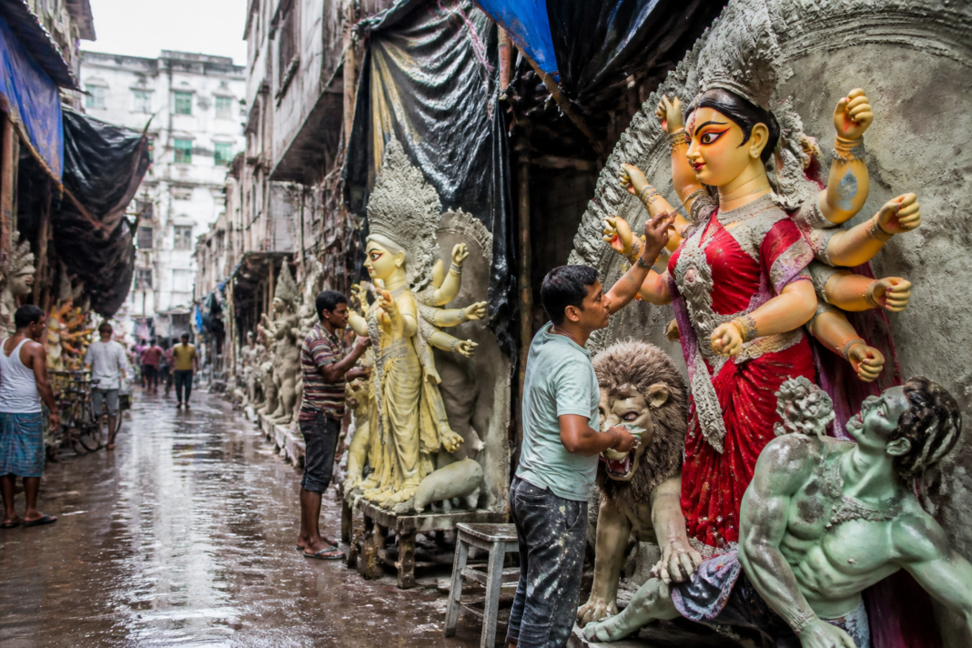 Kumartuli Durga idol making continues in Kolkata after rain delays.