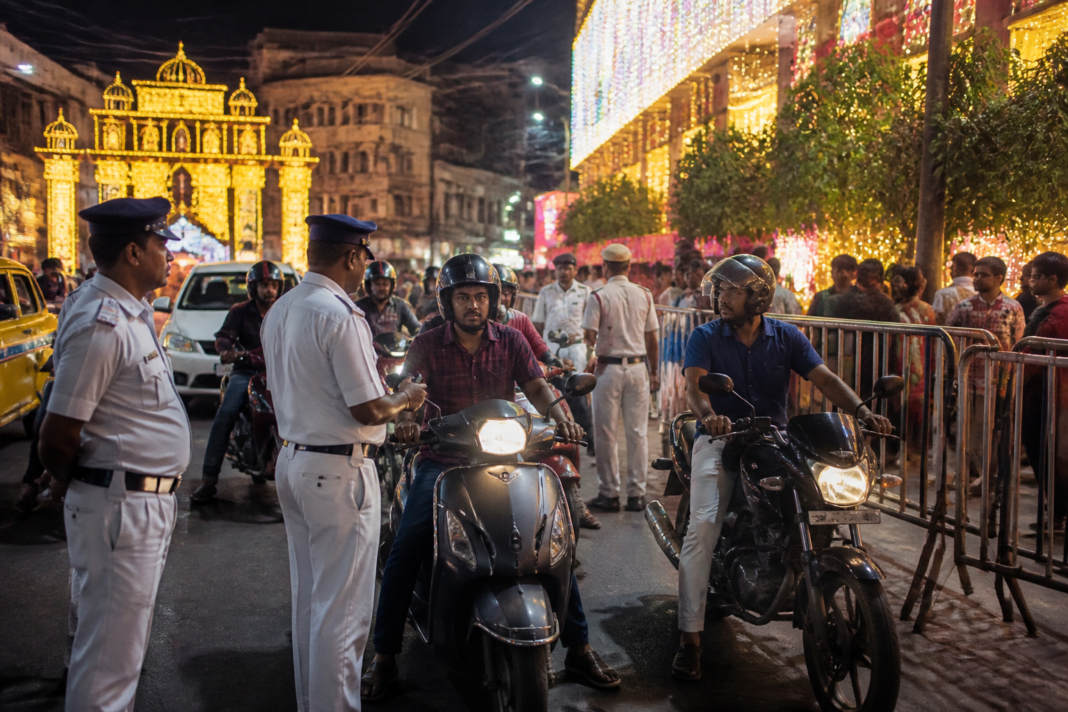 Kolkata Durga Puja traffic restrictions being enforced at a city road checkpoint