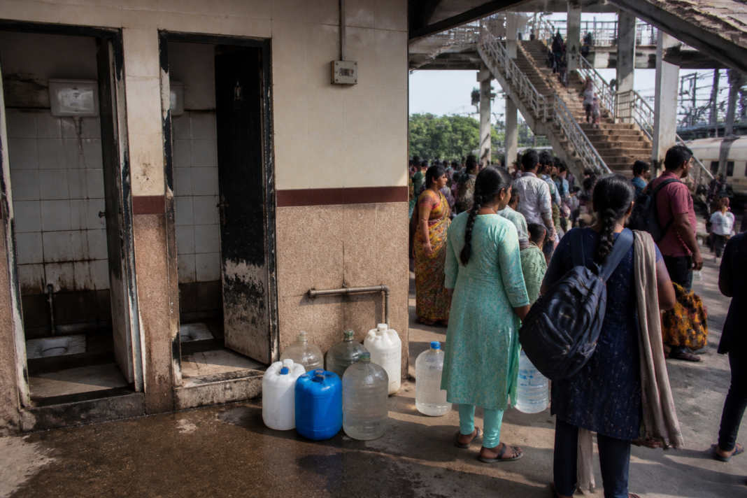 Chennai Central toilets near the suburban terminal with damaged doors and poor maintenance.