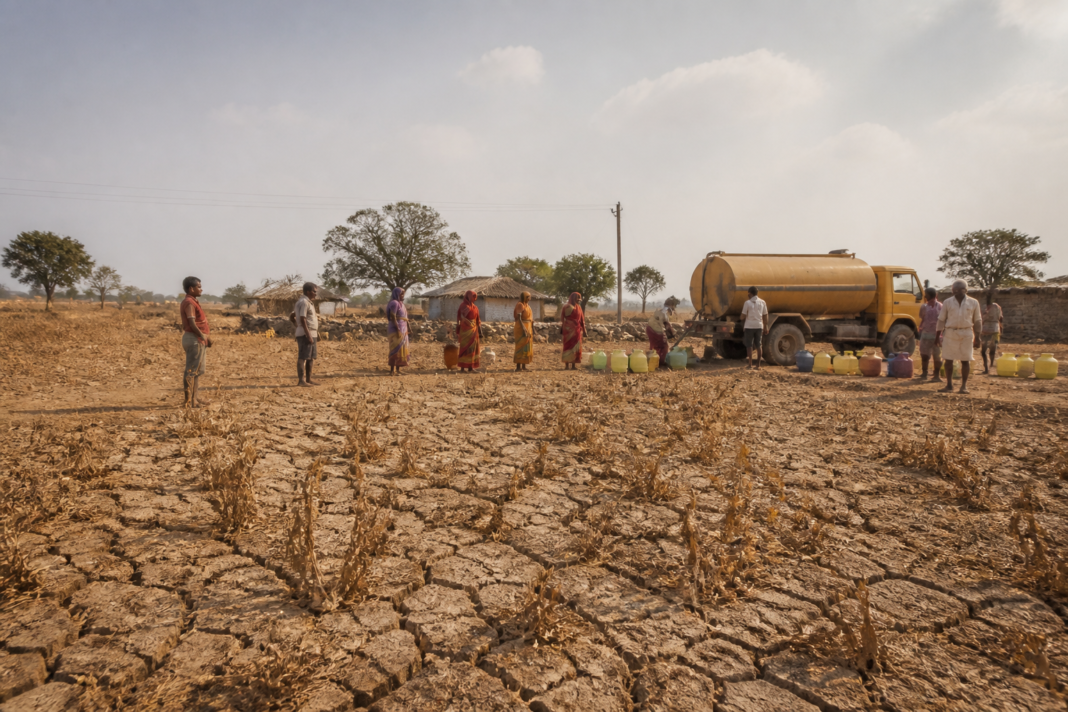 Karnataka drought relief assessment showing a dry agricultural field and tanker water supply