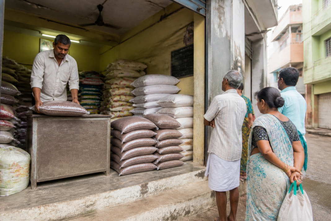 Bengaluru ration shop displaying foodgrain supplies and public distribution notices