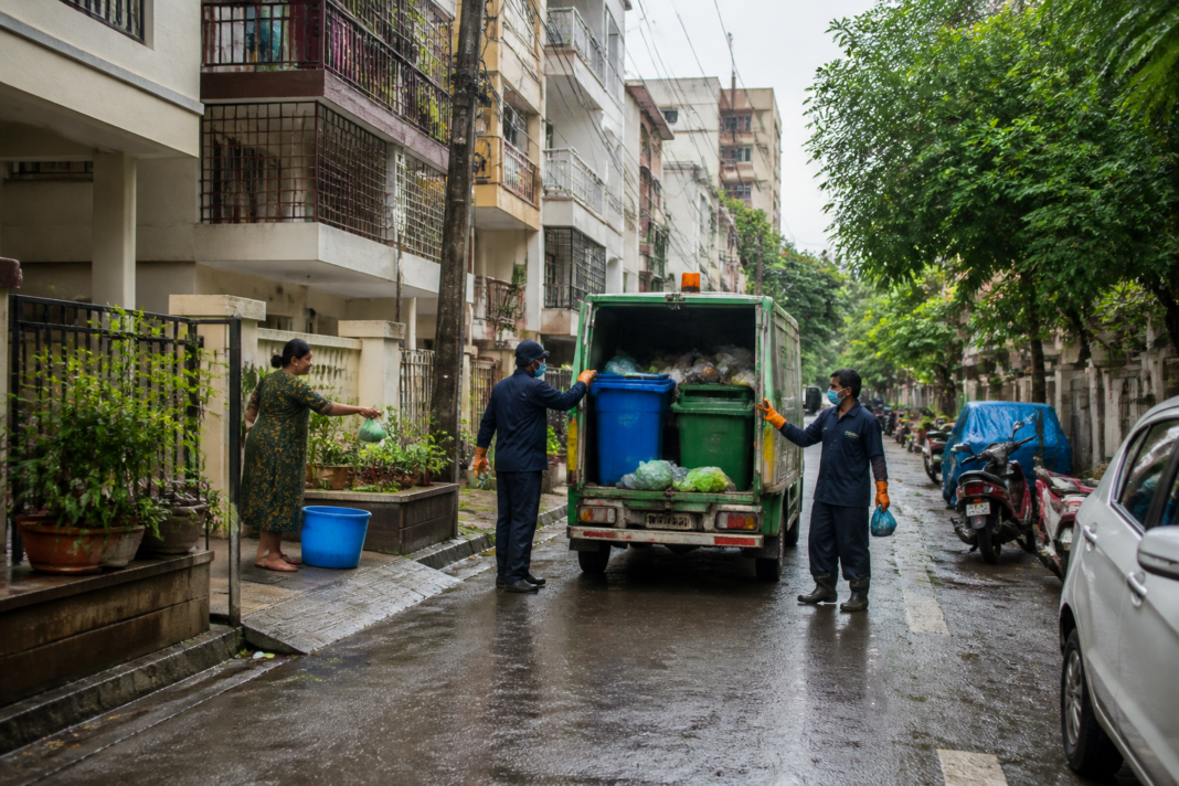 Cyberabad Municipal Corporation workers collecting waste from a Hyderabad neighbourhood