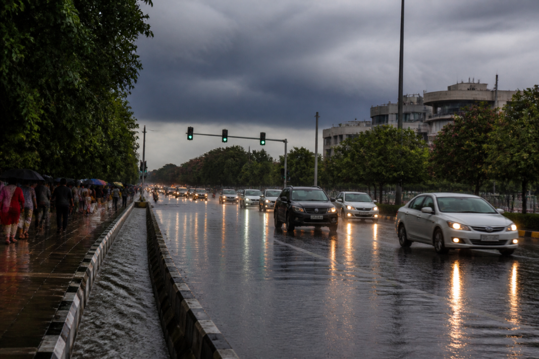 Karnataka rain forecast showing heavy rain over a Bengaluru road during a thunderstorm