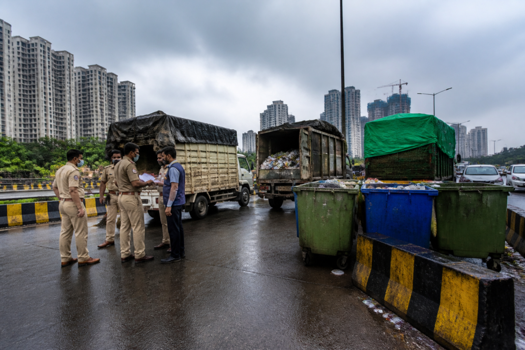 Gurugram waste dumping investigation involving garbage vehicles near an urban road