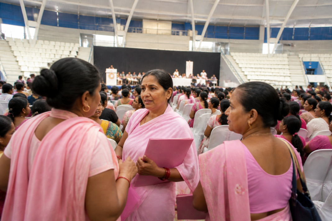 Delhi ASHA workers at a public health conference after the honorarium hike announcement