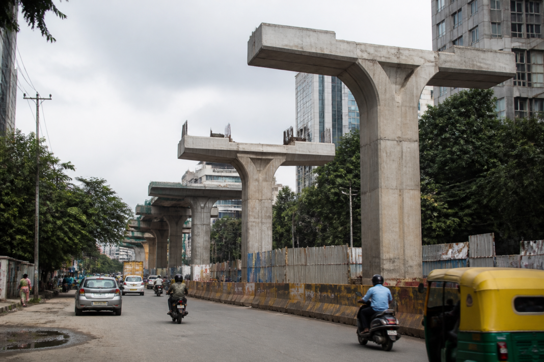 Bengaluru flyover construction site representing cancelled B-SMILE flyover tenders