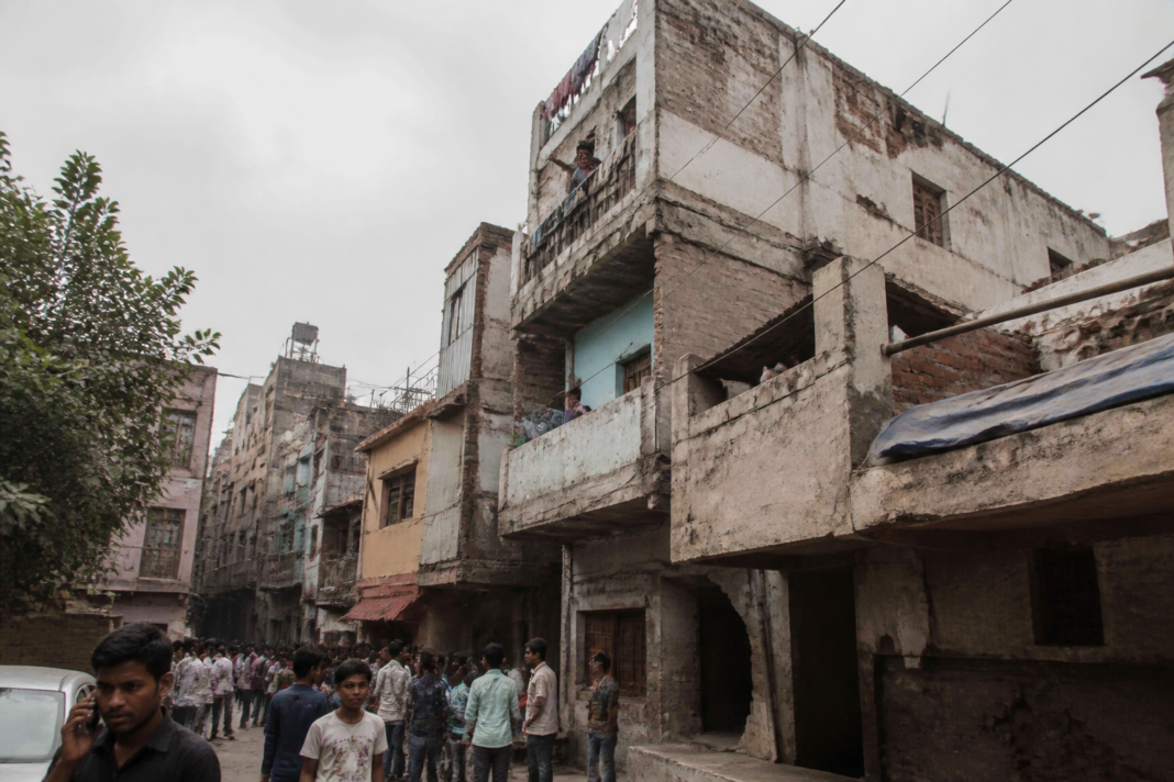 Delhi illegal construction in a dense Seemapuri neighbourhood with visibly deteriorated buildings