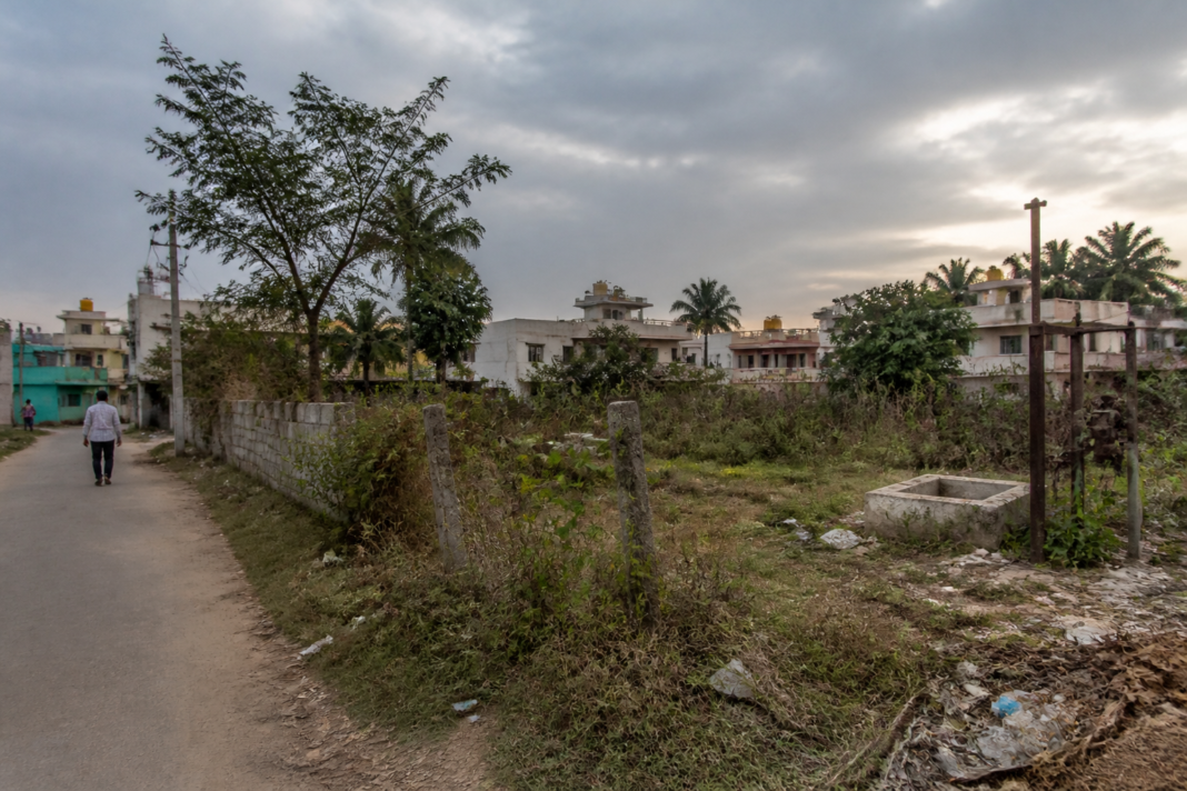 Bengaluru Dalit burial ground with overgrown vegetation and inadequate boundary infrastructure