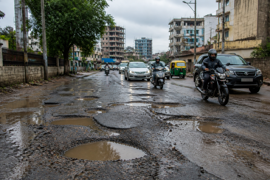 Bengaluru potholes on a damaged urban road near North Bengaluru
