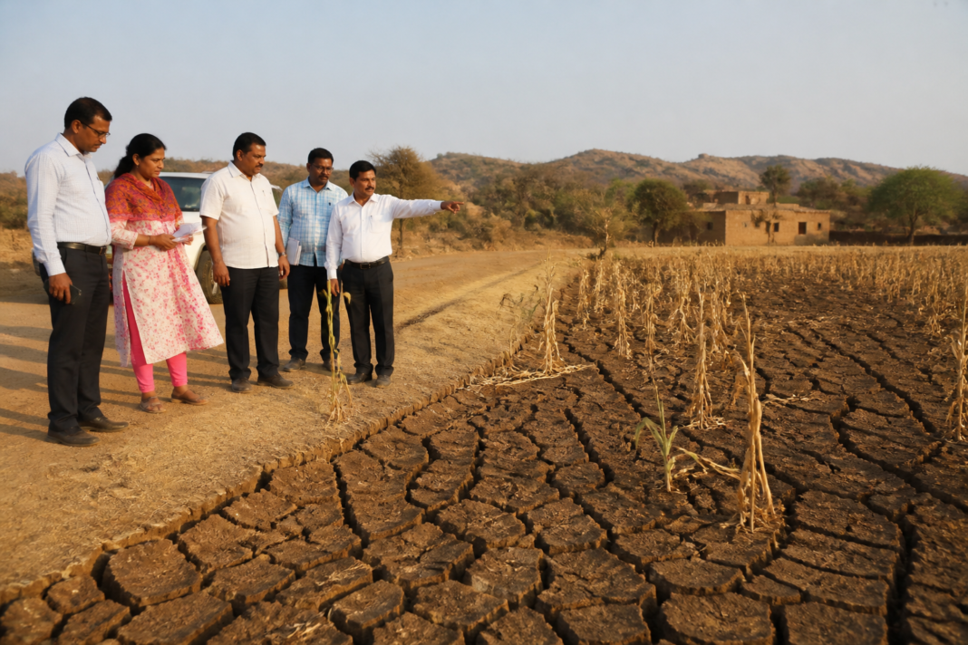 Karnataka drought assessment involving dry farmland and officials reviewing drought conditions in a taluk.